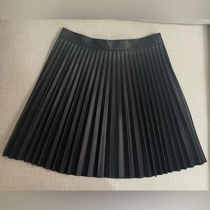 Topshop pleated black faux leather mini skirt. Size US 6.
